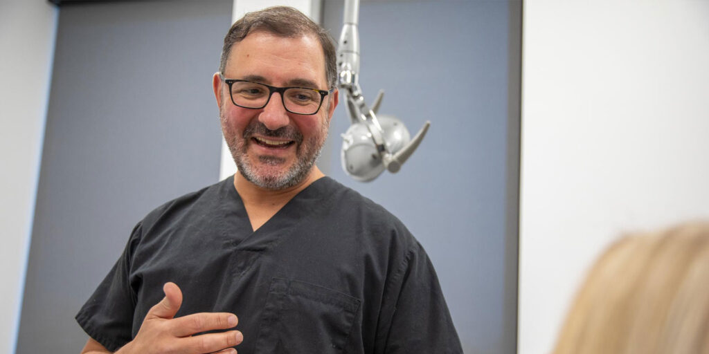 Dr. Mandelaris explaining oral surgery procedure
