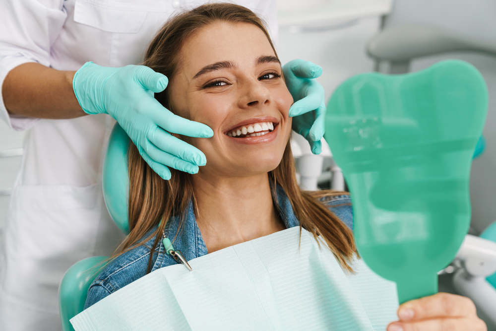 Dentist explaining dental cleaning differences to a patient